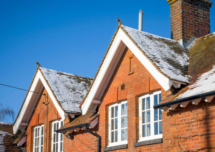House with sash windows and snow on roof